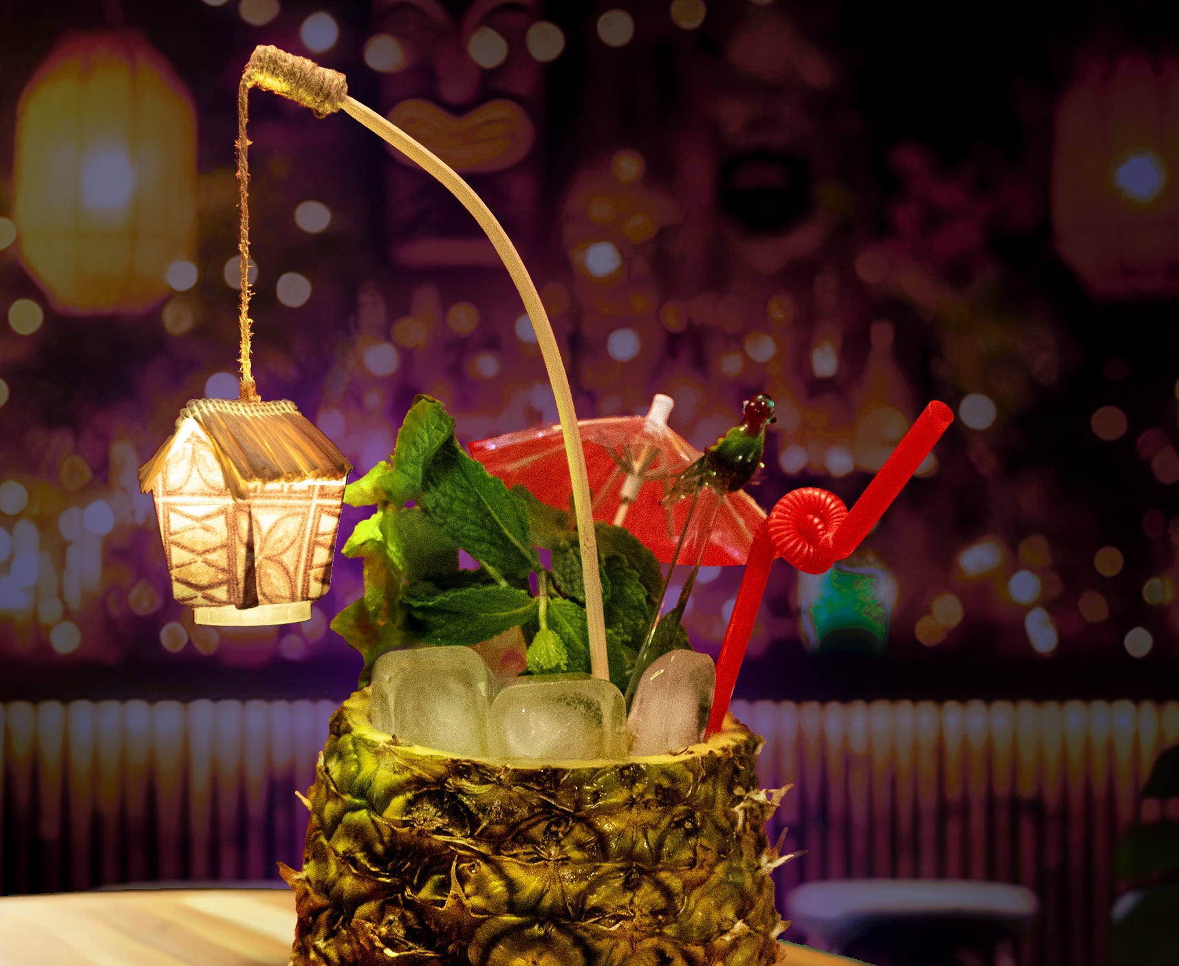 Handmade glowing tiki drink swizzle with tapa design