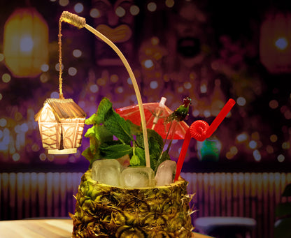Handmade glowing tiki drink swizzle with tapa design